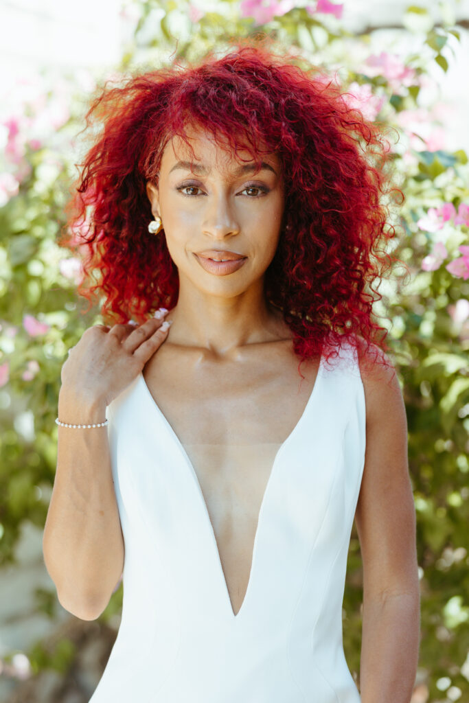 Image of ethnic african american modern bride with natural curly red hair.