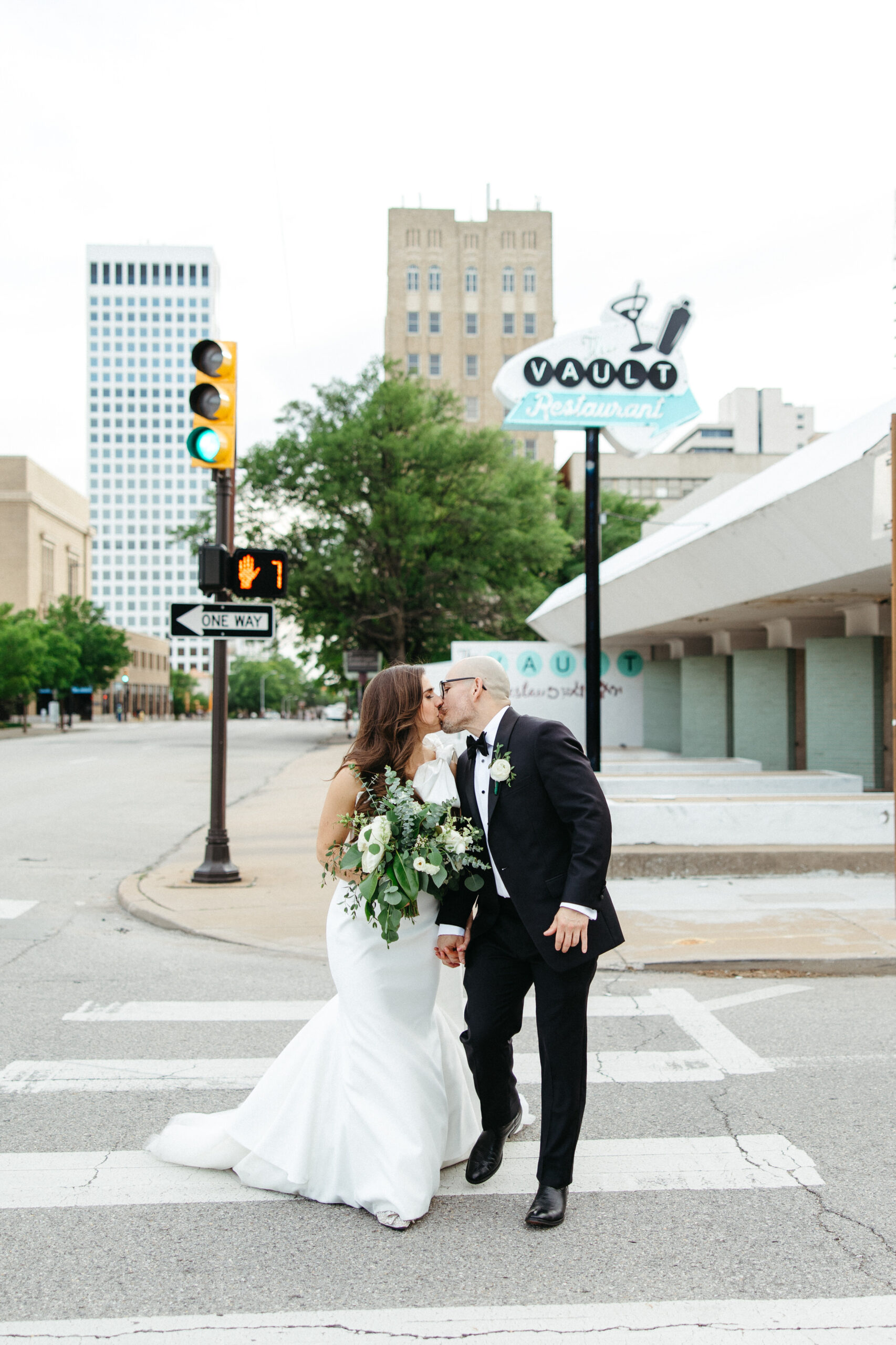 Bride and Groom outside of The Vault, a mid-century modern wedding venue in Tulsa